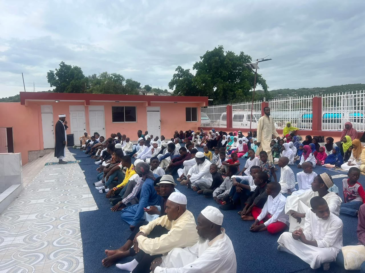 OMH outdoor congregation gathered for prayer in Haiti